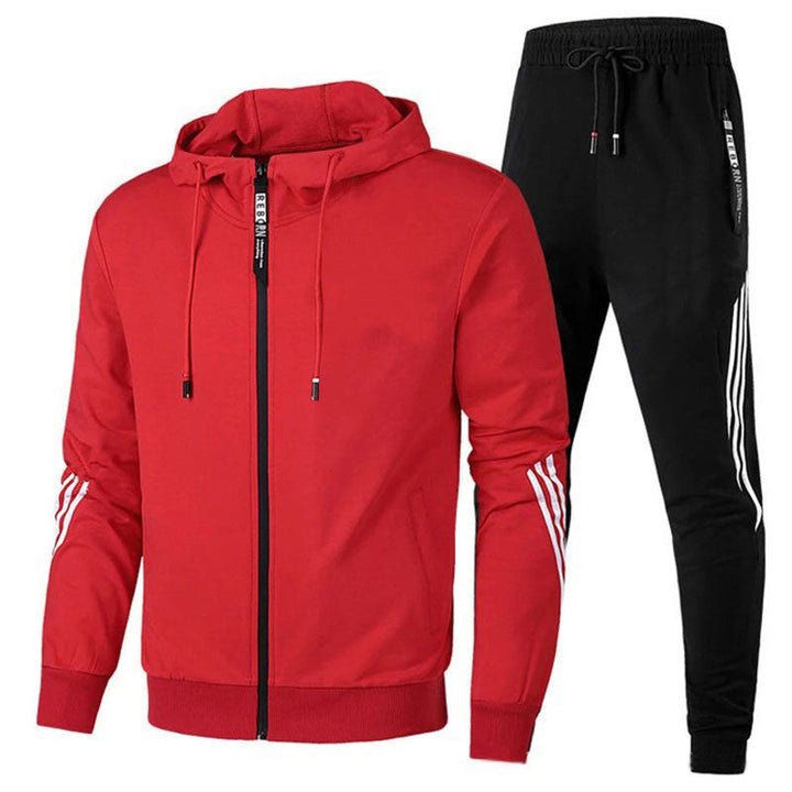 Heren trainingspak met rood ritsvest en zwarte joggingbroek