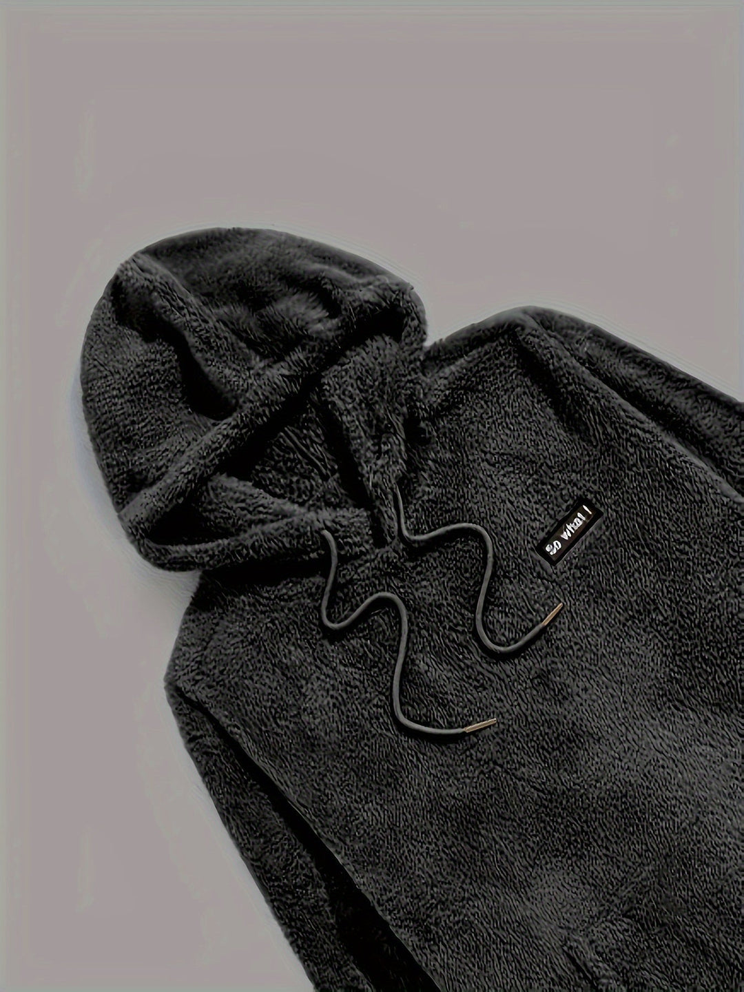 Detail van de capuchon met trekkoord in Zwart