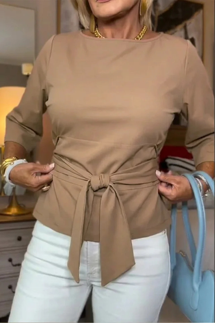 Dames top met strikceintuur in de taille