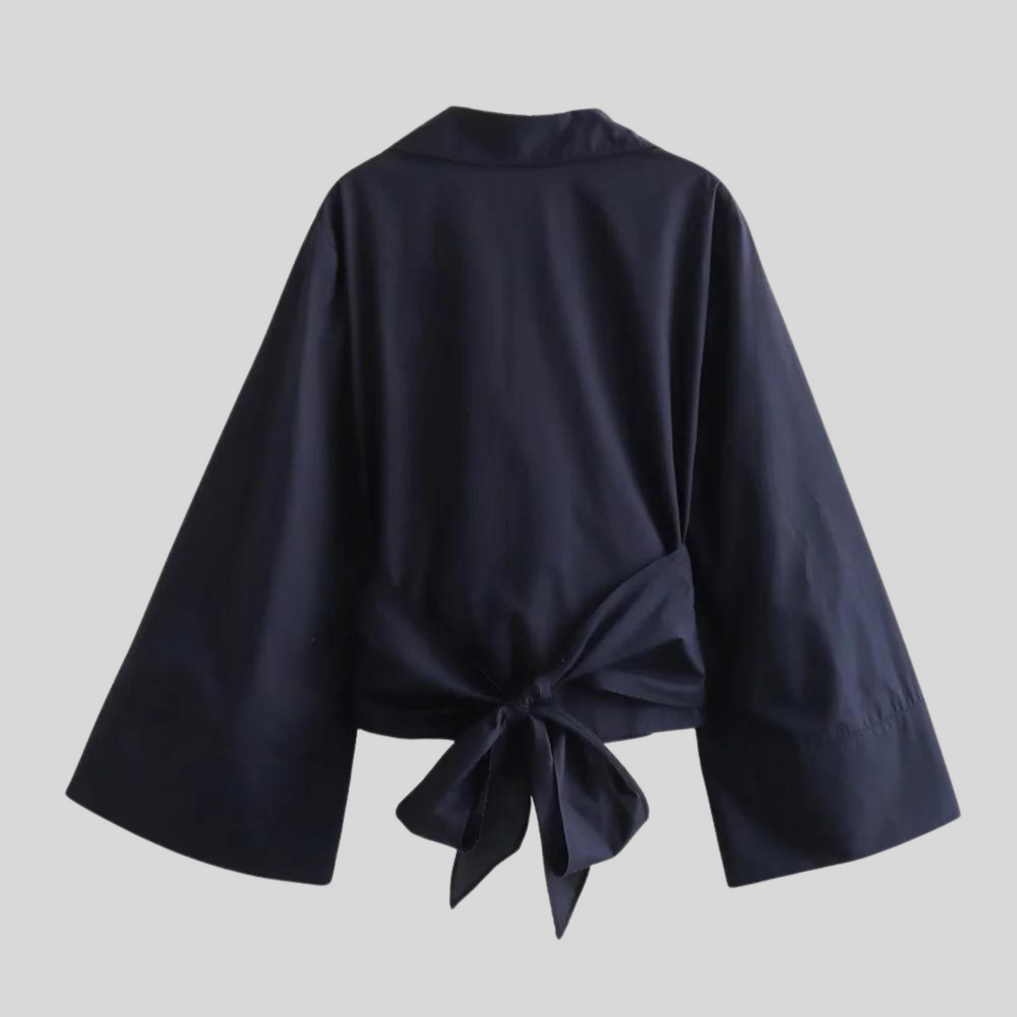 Damesblouse met wikkeldetails wijde mouwen en strikceintuur
