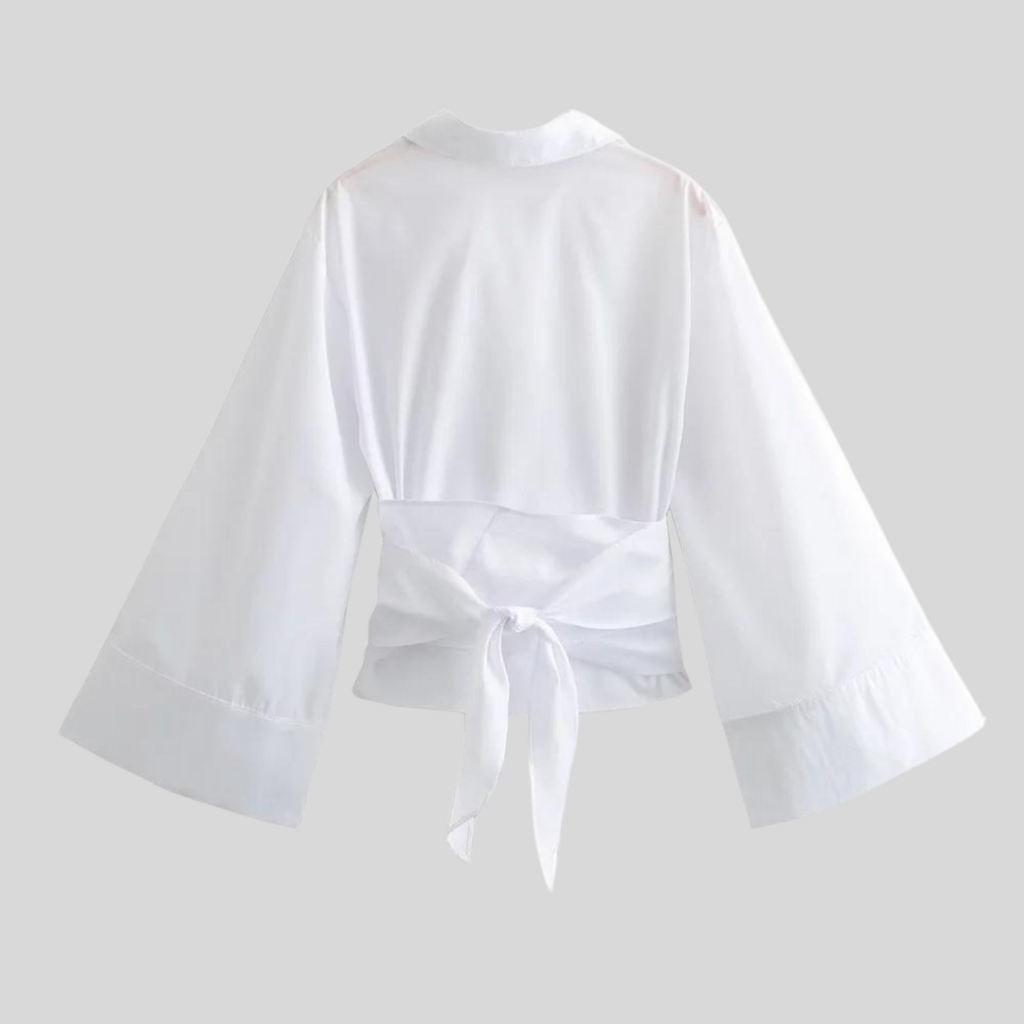 Damesblouse met wikkeldetails wijde mouwen en strikceintuur