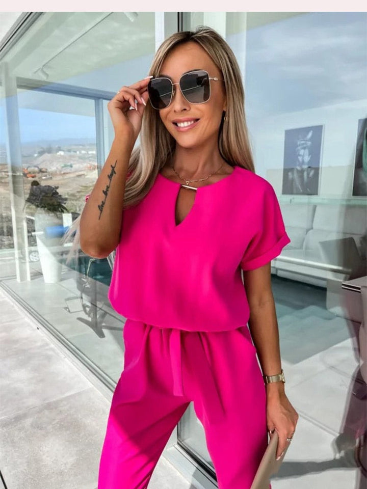 Dames jumpsuit in fuchsia met V-hals detail