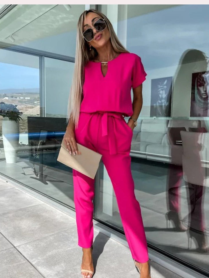 Dames jumpsuit in fuchsia met korte mouwen