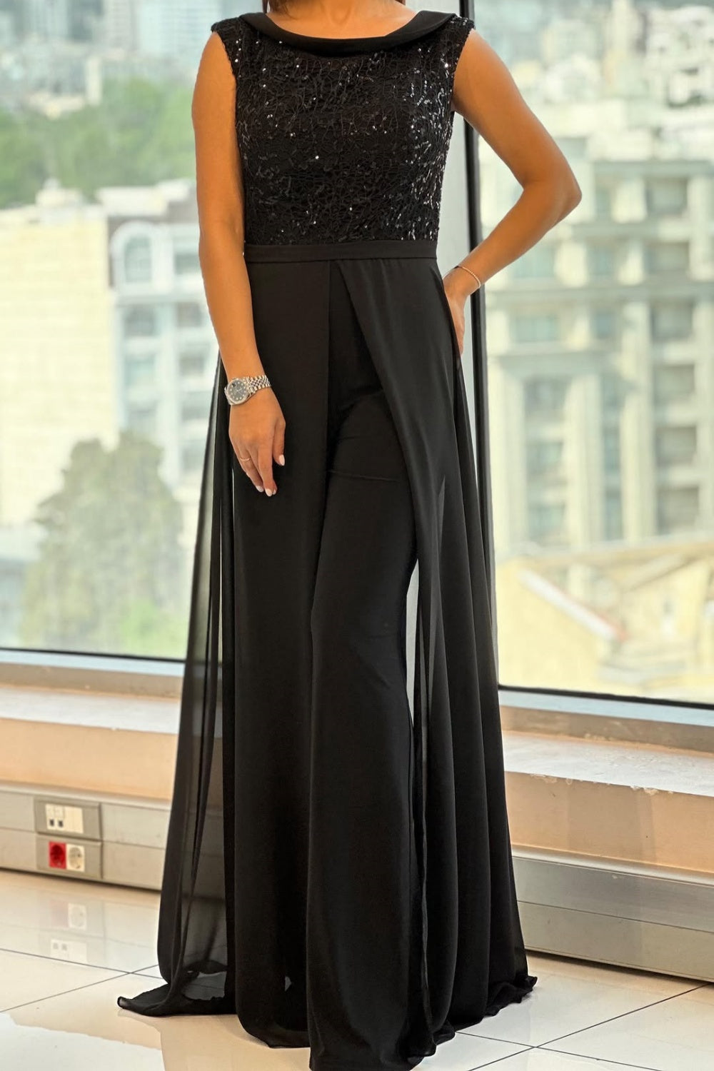 Dames avondjumpsuit met pailletten top en chiffon overlaag